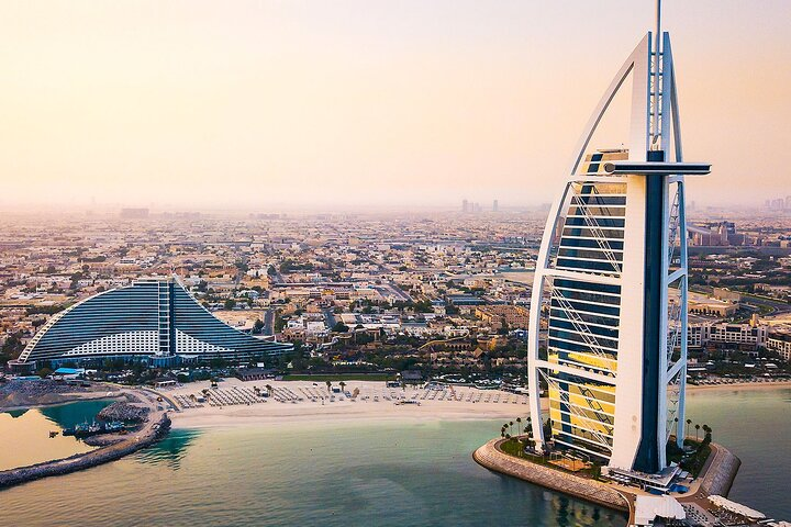 Explore Dubai’s iconic skyline with stunning landmarks like the Burj Al Arab and the modern coastline perfect for a memorable half-day adventure through this dynamic city.